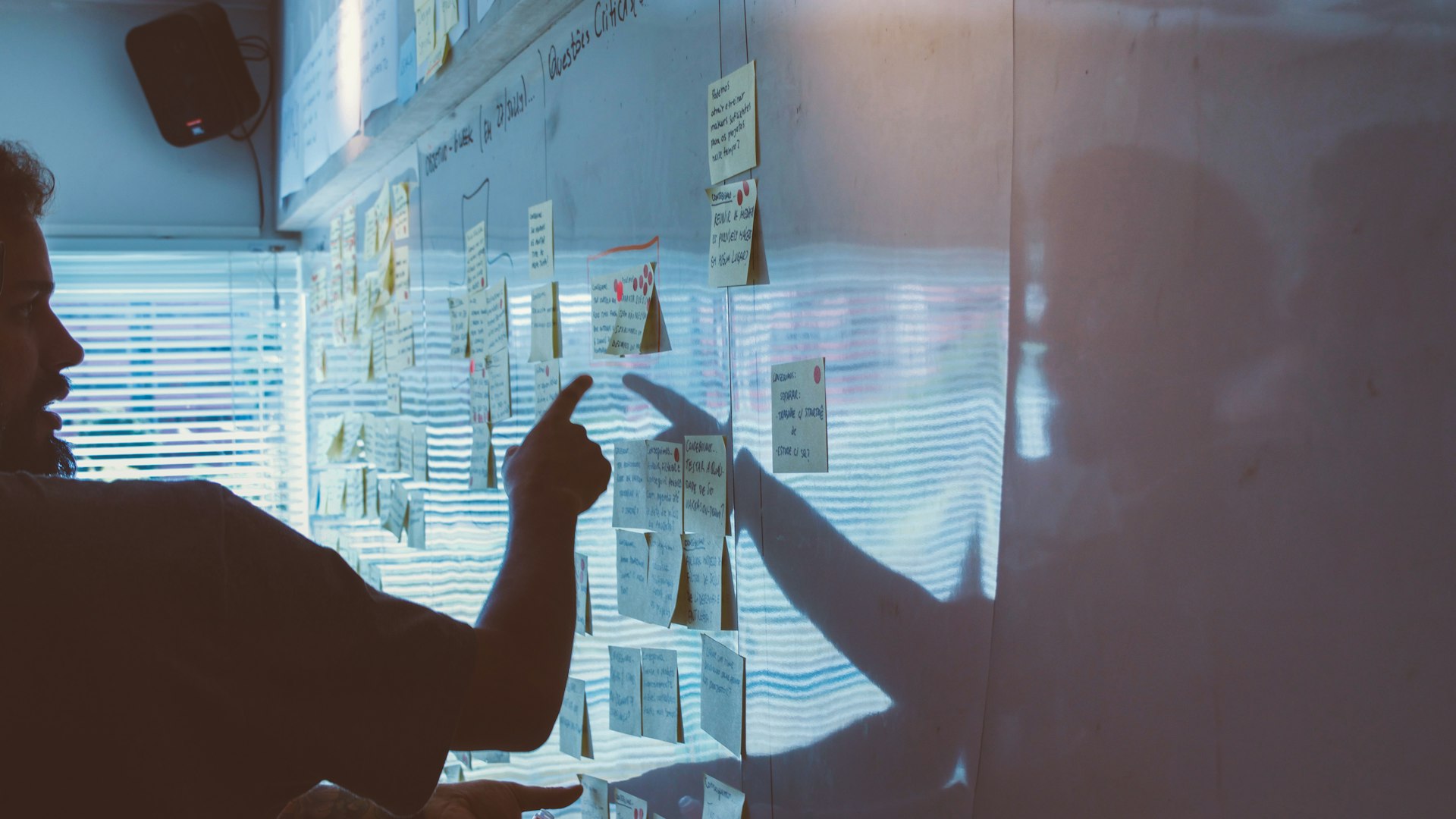 Analyst reviewing a cross-channel attribution model across dual monitors